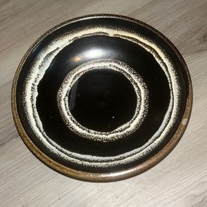 Black and white pottery storage bowl. Brown bottom.